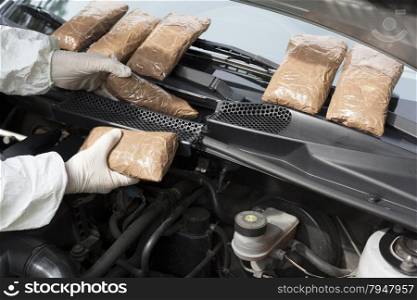 Hidden drugs in a vehicle compartment