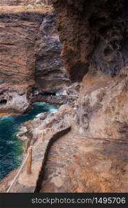 Hidden houses in the tourist attraction pirate cave of El Poris de Candelaria, in La Palma island, Canary islands, Spain.