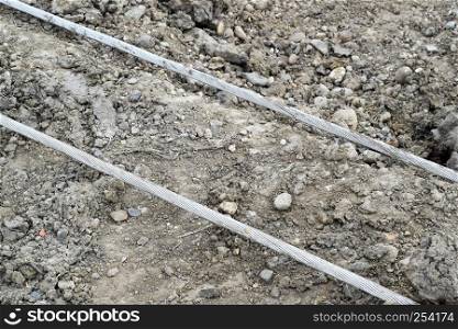 High aluminum wires on the ground. Installation of high-voltage power lines.. High aluminum wires on the ground. Installation of high-voltage power lines