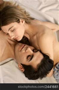 high angle alluring woman shirtless man bed 2