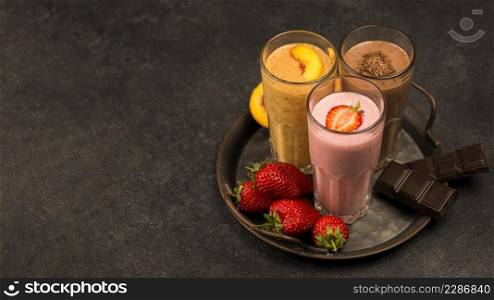 high angle assortment milkshakes with chocolate copy space
