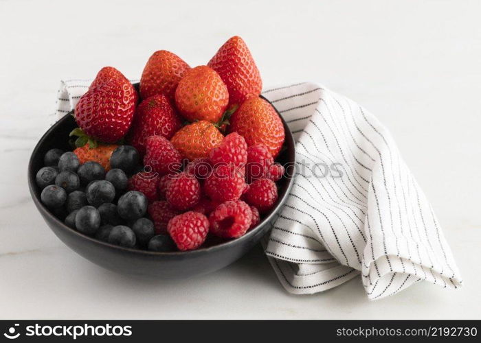 high angle bowl with fruits cloth