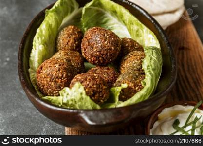 high angle bowl with lettuce falafel