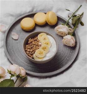 high angle breakfast bowl with cereal macarons