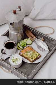 high angle breakfast sandwich bed with salmon cucumber