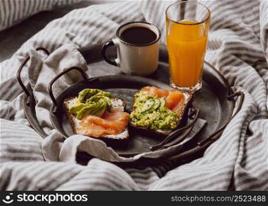high angle breakfast sandwiches bed with avocado salmon