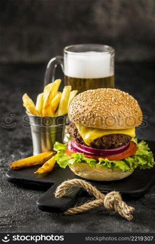 high angle burger with fries beer