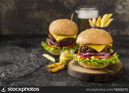 high angle burgers with fries sauce beer with copy space. Resolution and high quality beautiful photo. high angle burgers with fries sauce beer with copy space. High quality beautiful photo concept
