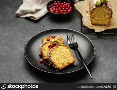 high angle cake slices plate with fork berries