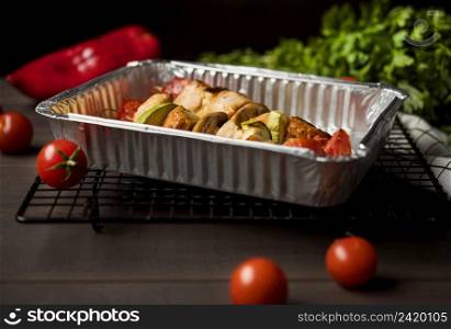 high angle chicken skewers tray with red pepper cherry tomatoes