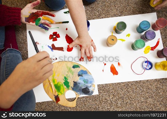 high angle child woman painting. High resolution photo. high angle child woman painting. High quality photo