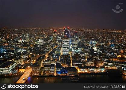 High angle cityscape of river Thames and city lights at night, London, England, UK