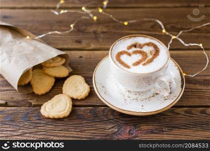 high angle coffee cup heart shaped cookies