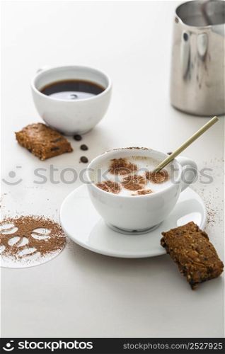 high angle coffee cups with dessert plate