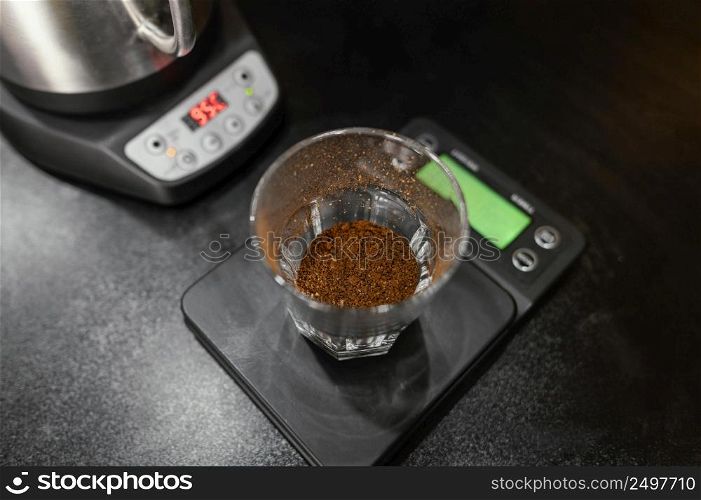 high angle coffee glass scale with kettle