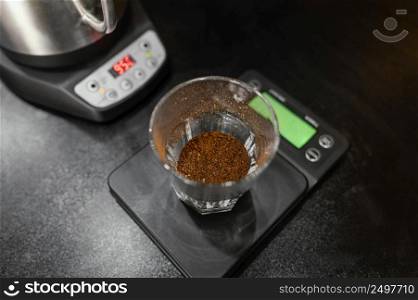high angle coffee glass scale with kettle