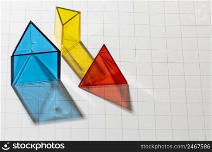 high angle colorful translucent geometric shapes with copy space