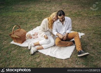high angle couple having picnic