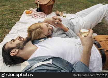 high angle couple having picnic together outdoors