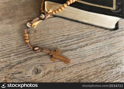 high angle cross rosary with holy book