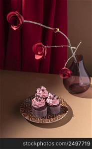high angle cupcakes plate paper roses
