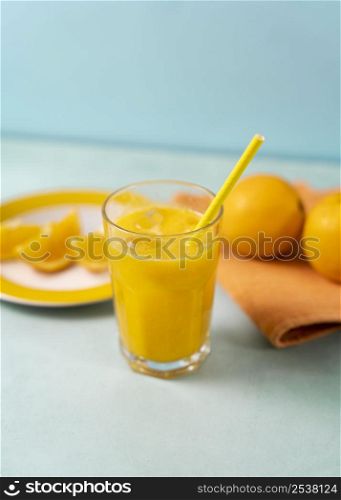 high angle delicious orange juice with straw