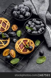 high angle delicious pies with plums cooling rack