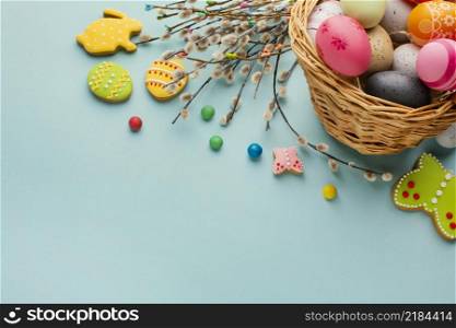 high angle easter eggs basket with bunny butterfly shapes