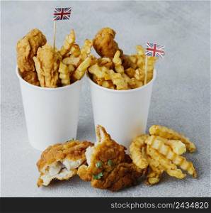 high angle fish chips paper cups with great britain flags