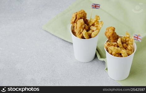 high angle fish chips paper cups with great britain flags copy space