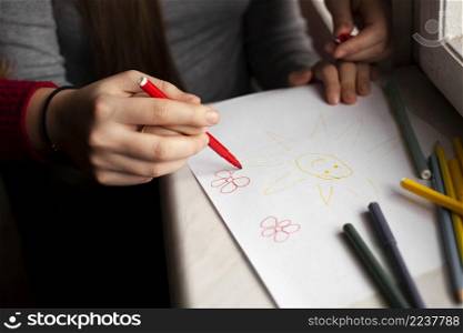 high angle girl with down syndrome woman drawing