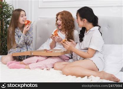 high angle girlfriends eating pizza