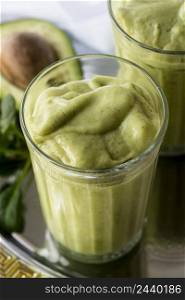 high angle green smoothie with avocado