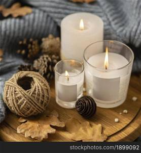 high angle lit candles with string pine cones. Resolution and high quality beautiful photo. high angle lit candles with string pine cones. High quality beautiful photo concept