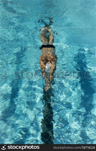 high angle male swimmer swimming water pool. High resolution photo. high angle male swimmer swimming water pool. High quality photo