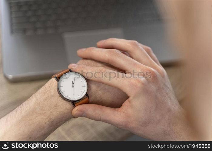 high angle man looking his watch. High resolution photo. high angle man looking his watch. High quality photo