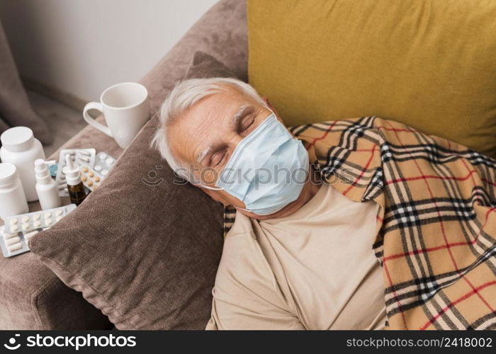 high angle man sleeping with mask