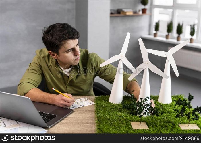 high angle man working eco friendly wind power project