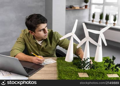 high angle man working eco friendly wind power project