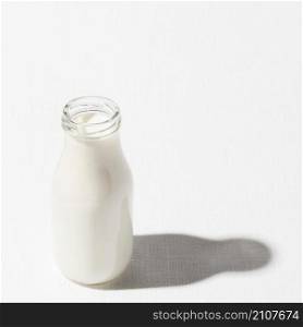 high angle milk bottle with copy space