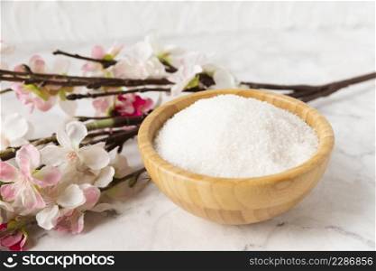 high angle mineral salt with flower beside