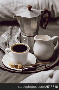 high angle morning coffee bed with milk kettle