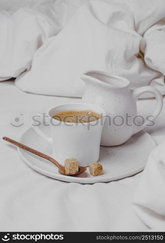 high angle morning coffee with sugar cubes