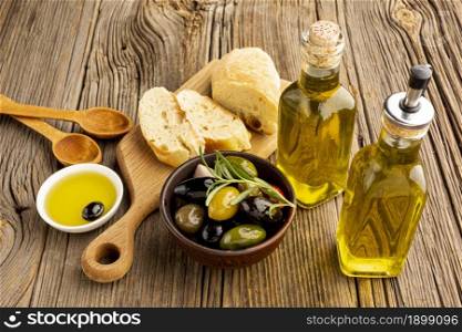 high angle olives mix bread oil bottles. Resolution and high quality beautiful photo. high angle olives mix bread oil bottles. High quality beautiful photo concept