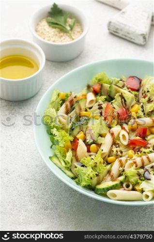 high angle pasta salad with balsamic vinegar sesame seeds oil