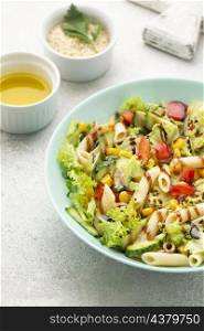 high angle pasta salad with balsamic vinegar sesame seeds oil