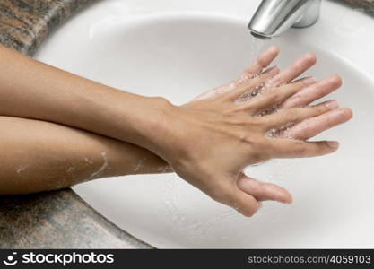 high angle person washing hands