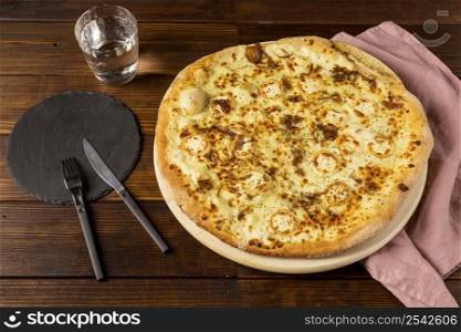 high angle pizza with cheese cutlery