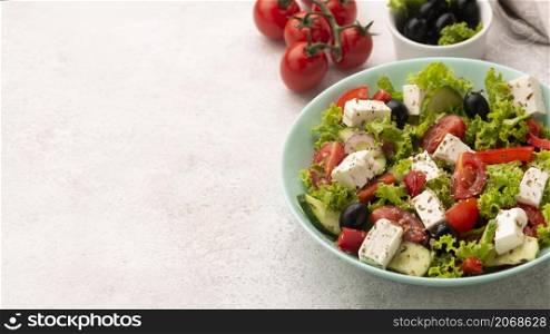 high angle salad with feta cheese tomatoes olives with copy space