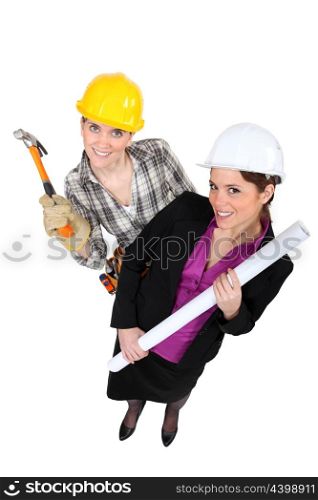 High-angle shot of a tradeswoman standing next to an engineer